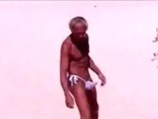 Tanned guy on beach in tiny string thong (temporarily!)